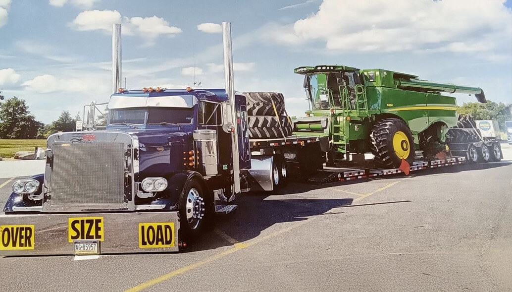Peterbilt Semi Pulling John Deere Combine